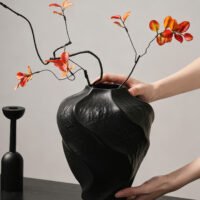 Modern mountain spiral sculptural ceramic art vase in matte obsidian black and marble white