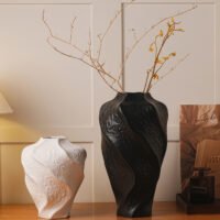 Modern mountain spiral sculptural ceramic art vase in matte obsidian black and marble white